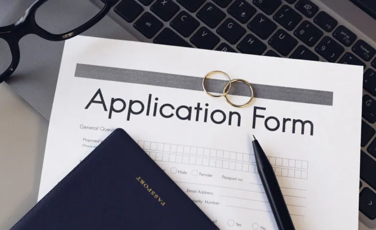 Visa application form and passport for marriage. Application to register permanent residence. Immigration concept